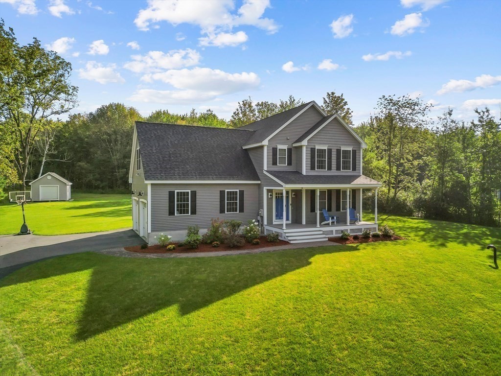 54 Lane Road Derry, NH 03038 - Photo 1 of 34 a view of a house with a swimming pool