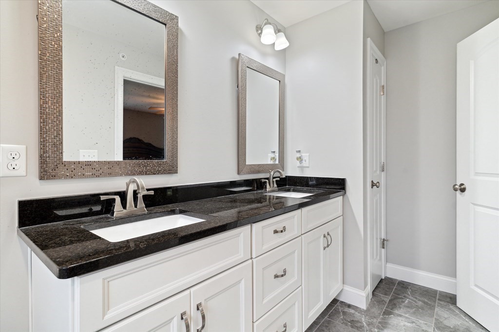 54 Lane Road Derry, NH 03038 - Photo 14 of 34 a bathroom with a sink and a mirror