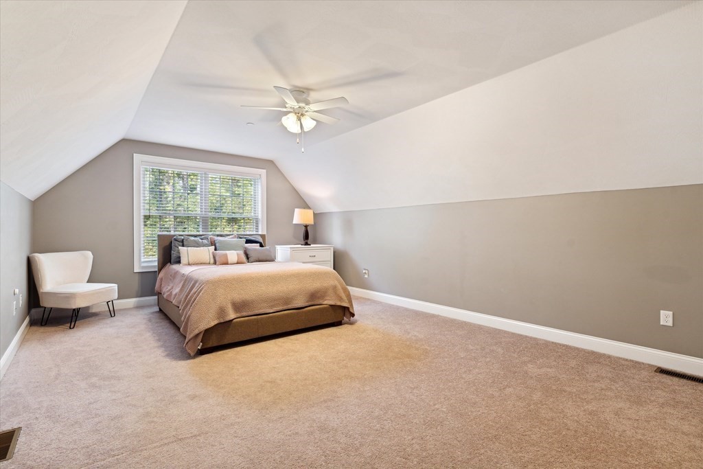 54 Lane Road Derry, NH 03038 - Photo 16 of 34 a bedroom with a large bed and ceiling fan