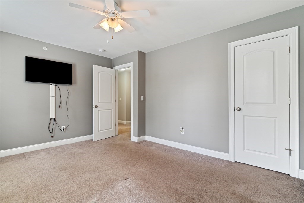 54 Lane Road Derry, NH 03038 - Photo 18 of 34 a view of an empty room with a window