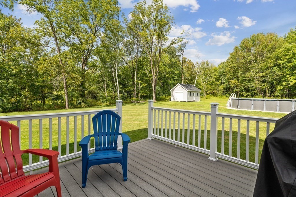 54 Lane Road Derry, NH 03038 - Photo 21 of 34 a view of a two chairs in the deck