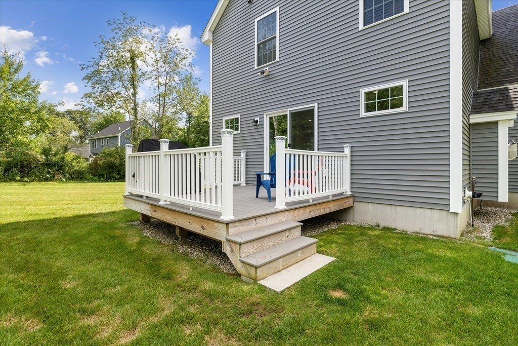 54 Lane Road Derry, NH 03038 - Photo 22 of 34 a view of a house with a yard and sitting area