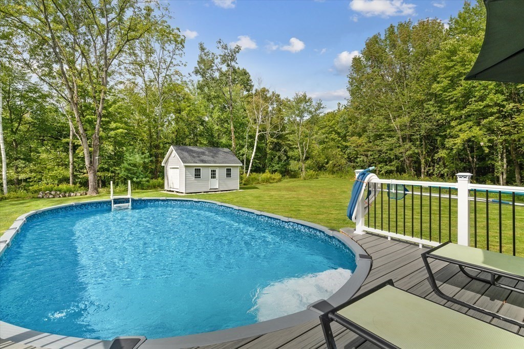 54 Lane Road Derry, NH 03038 - Photo 24 of 34 a view of a chairs and table on the deck
