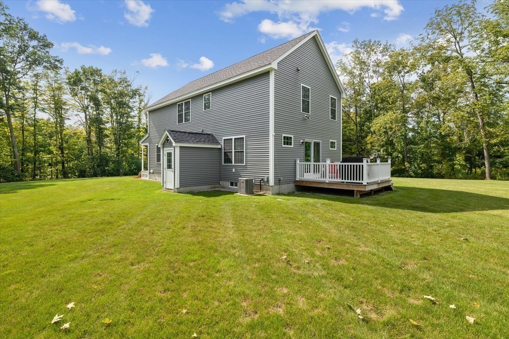 54 Lane Road Derry, NH 03038 - Photo 28 of 34 a front view of house with yard and trees