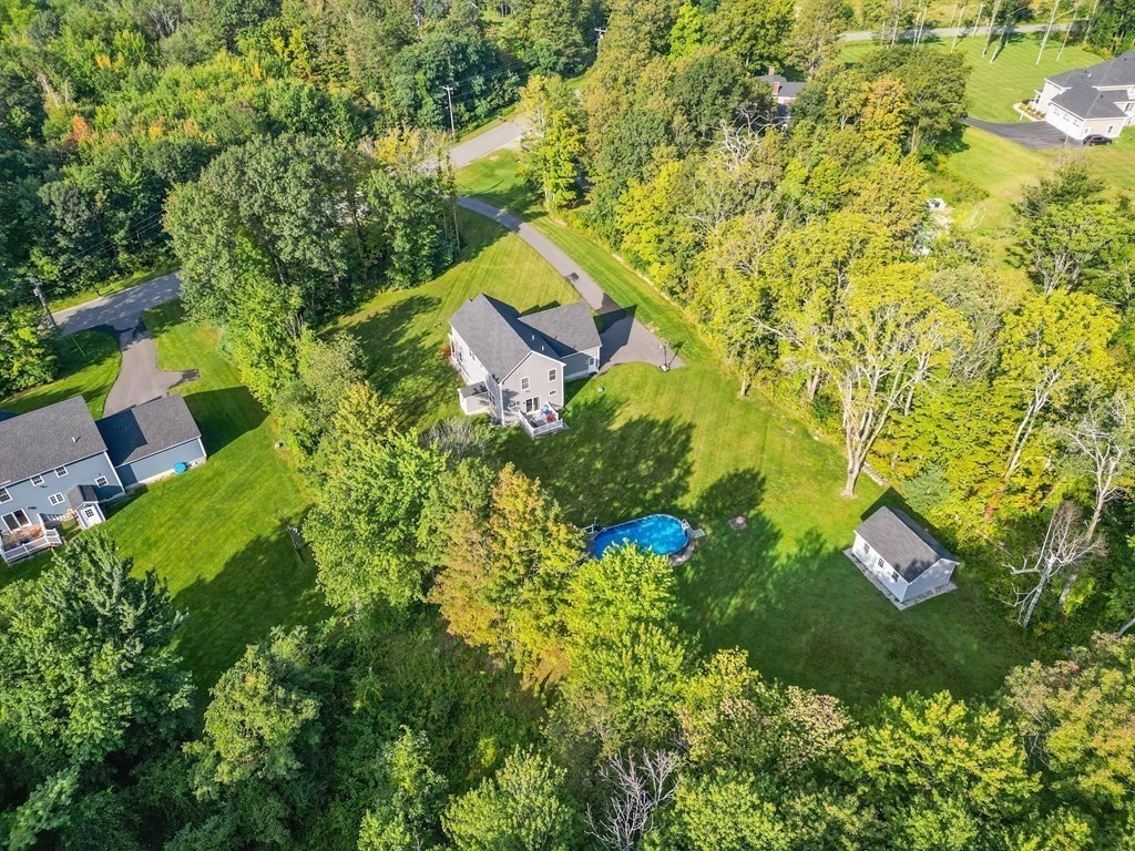 54 Lane Road Derry, NH 03038 - Photo 3 of 34 an aerial view of residential house with swimming pool and garden space