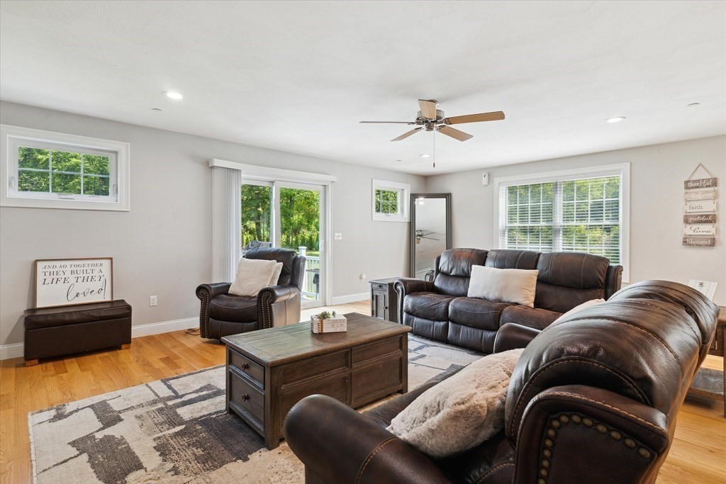54 Lane Road Derry, NH 03038 - Photo 9 of 34 a living room with furniture and a large window
