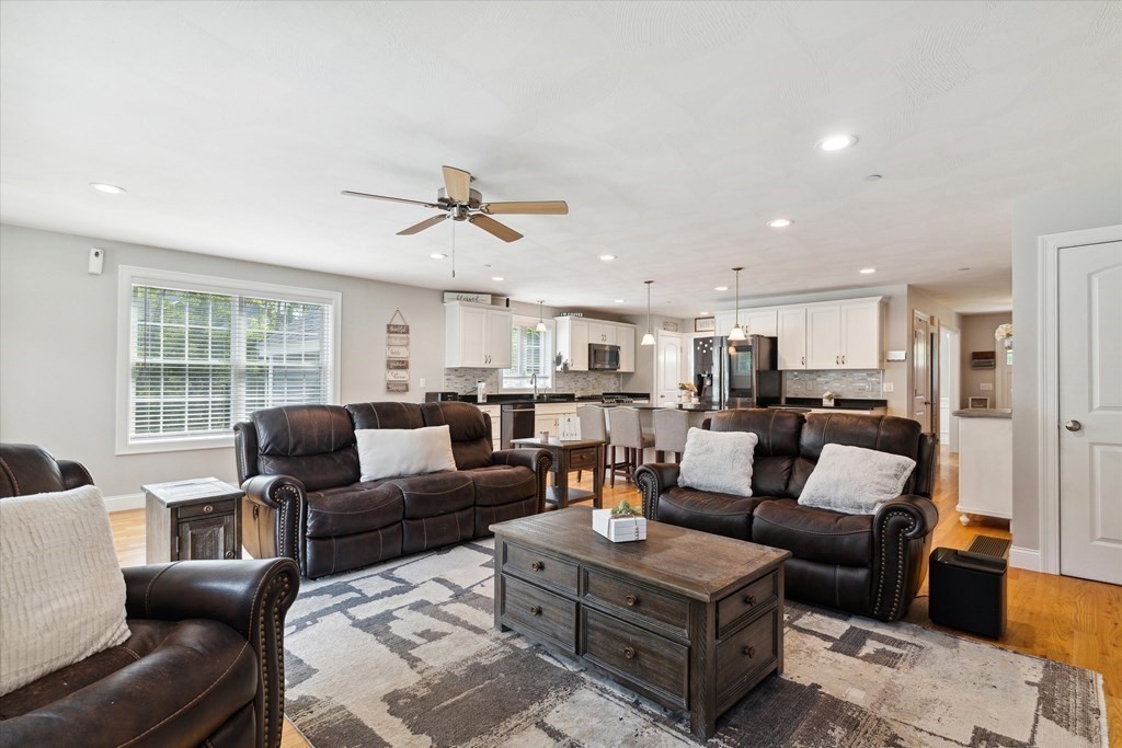 54 Lane Road Derry, NH 03038 - Photo 10 of 34 a living room with furniture kitchen view and a window