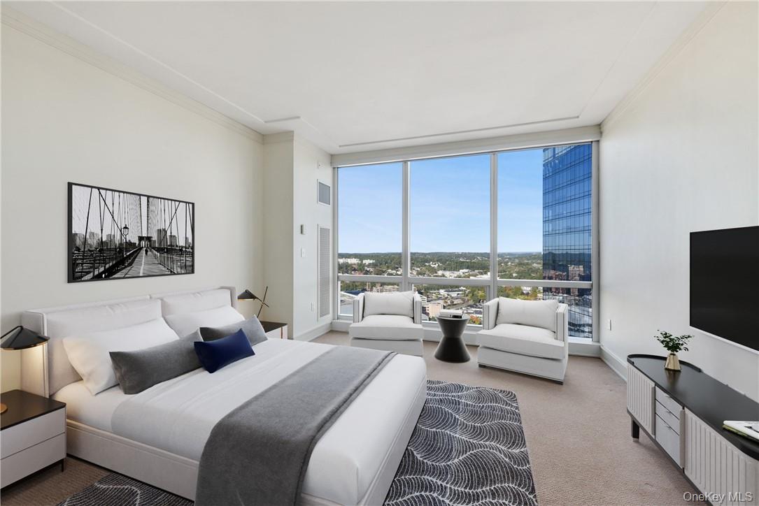 1 Renaissance Square, Unit V4G White Plains, NY 10601 - Photo 11 of 17 a hotel room with large window and couch