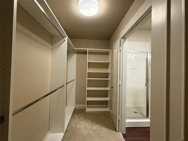 a bathroom with a bathtub a toilet and a shower