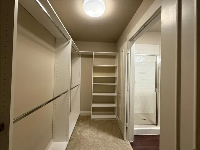 a bathroom with a bathtub a toilet and a shower