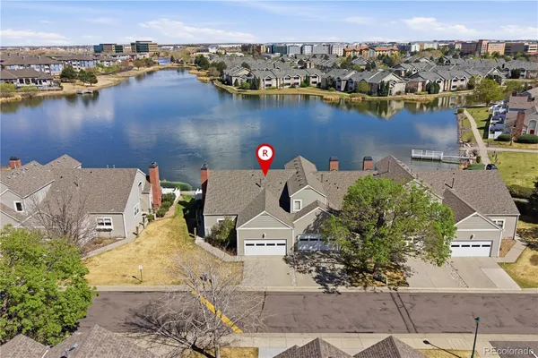an aerial view of a house with a lake view