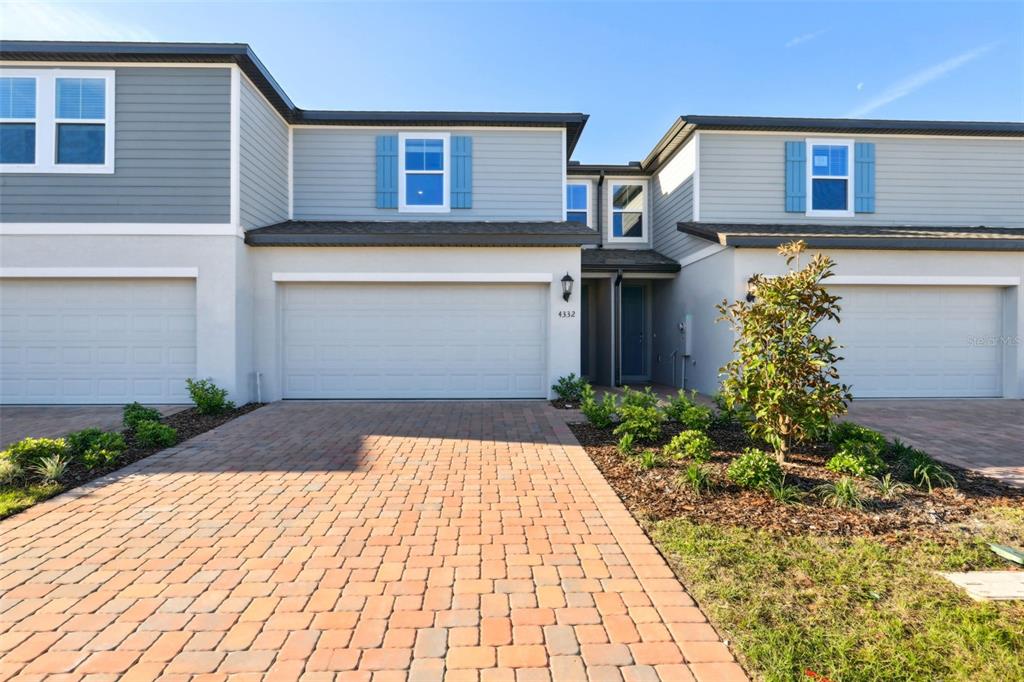 4332 Ranch House Road St. Cloud, FL 34772 - Photo 1 of 1 a front view of a house with garden