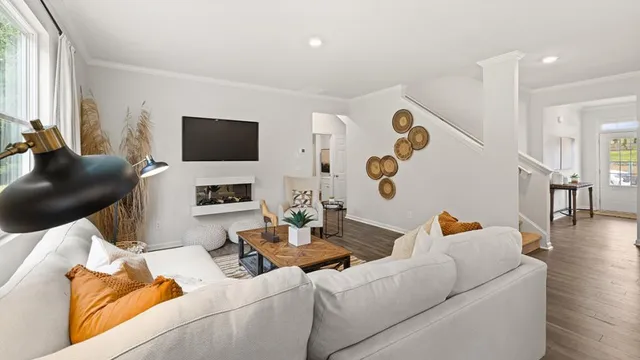 a living room with furniture and a window