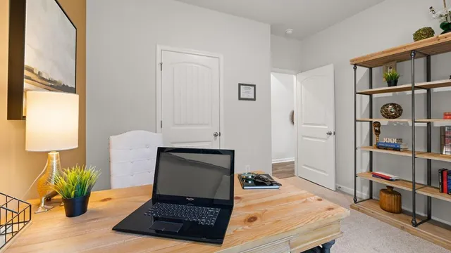 a bedroom with a bed and chair