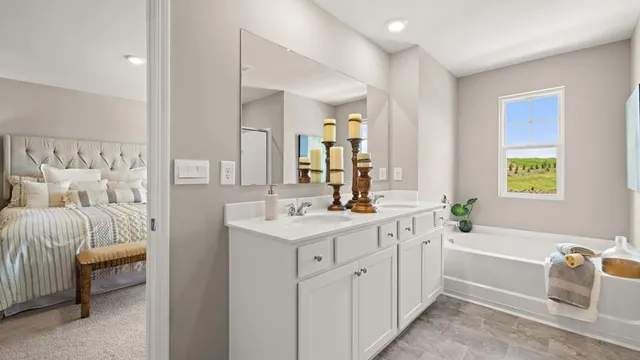 a view of a hallway with closet and mirror