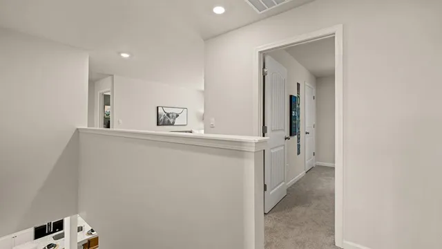 a bedroom with a bed and a chair in it