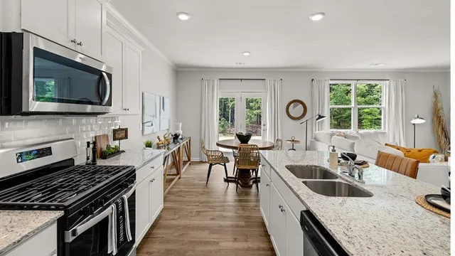 a dining room with furniture and wooden floor