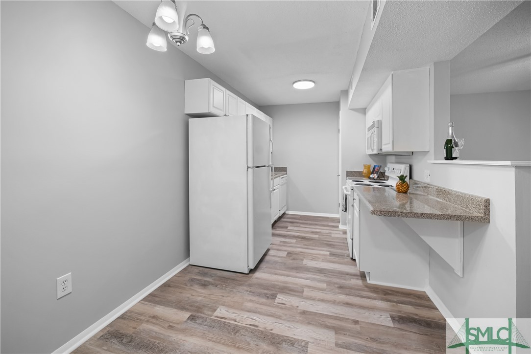 401 North Cromwell Road, Unit T7 Savannah, GA 31410 - Photo 6 of 41 Galley style kitchen makes for a efficient space