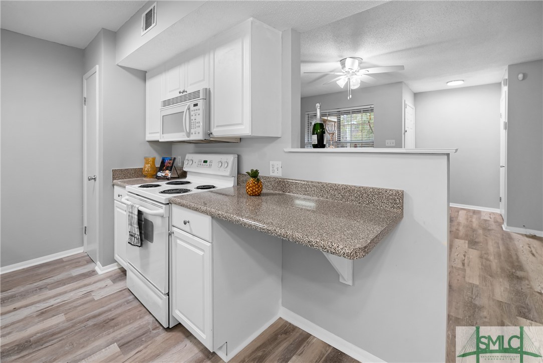 401 North Cromwell Road, Unit T7 Savannah, GA 31410 - Photo 8 of 41 Bar to be used for extra counter or add a chair fo