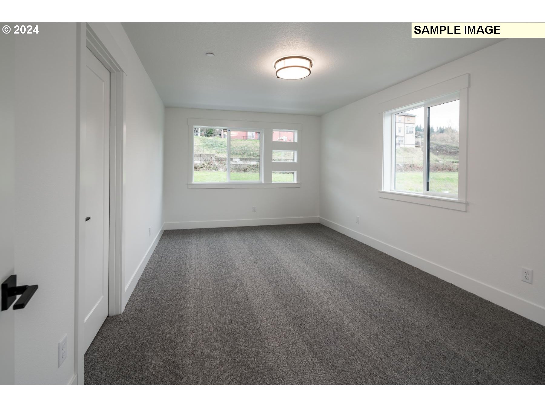 1116 North Helens Vw Drive Ridgefield, WA 98642 - Photo 20 of 23 a view of an empty room with wooden floor and a window