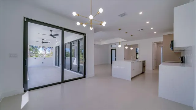 a kitchen with stainless steel appliances a stove microwave and sink