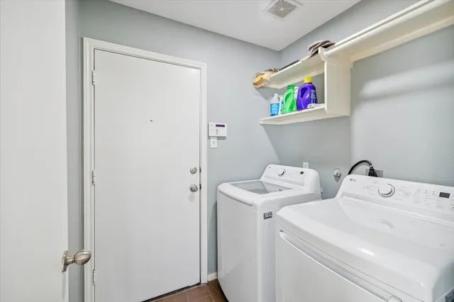 a utility room with dryer and washer