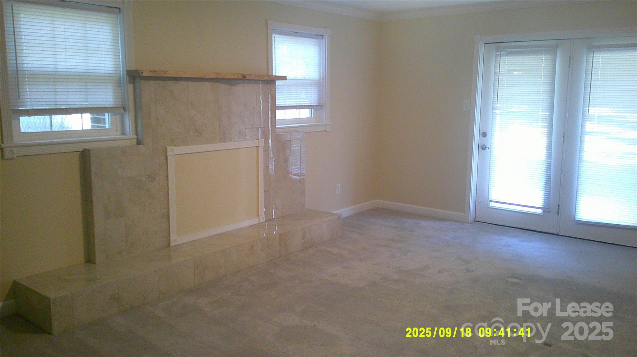 2521 31st St Drive Northeast Hickory, NC 28601 - Photo 14 of 17 an empty room with windows cabinet and front door