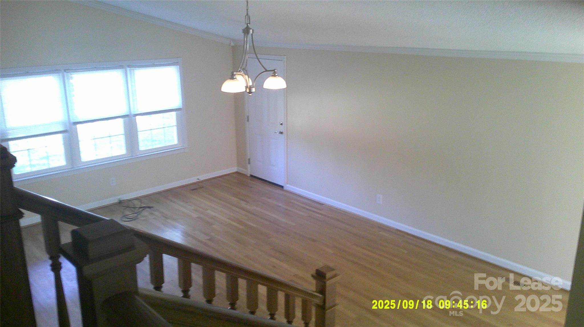 2521 31st St Drive Northeast Hickory, NC 28601 - Photo 5 of 17 wooden floor in an empty room with a window