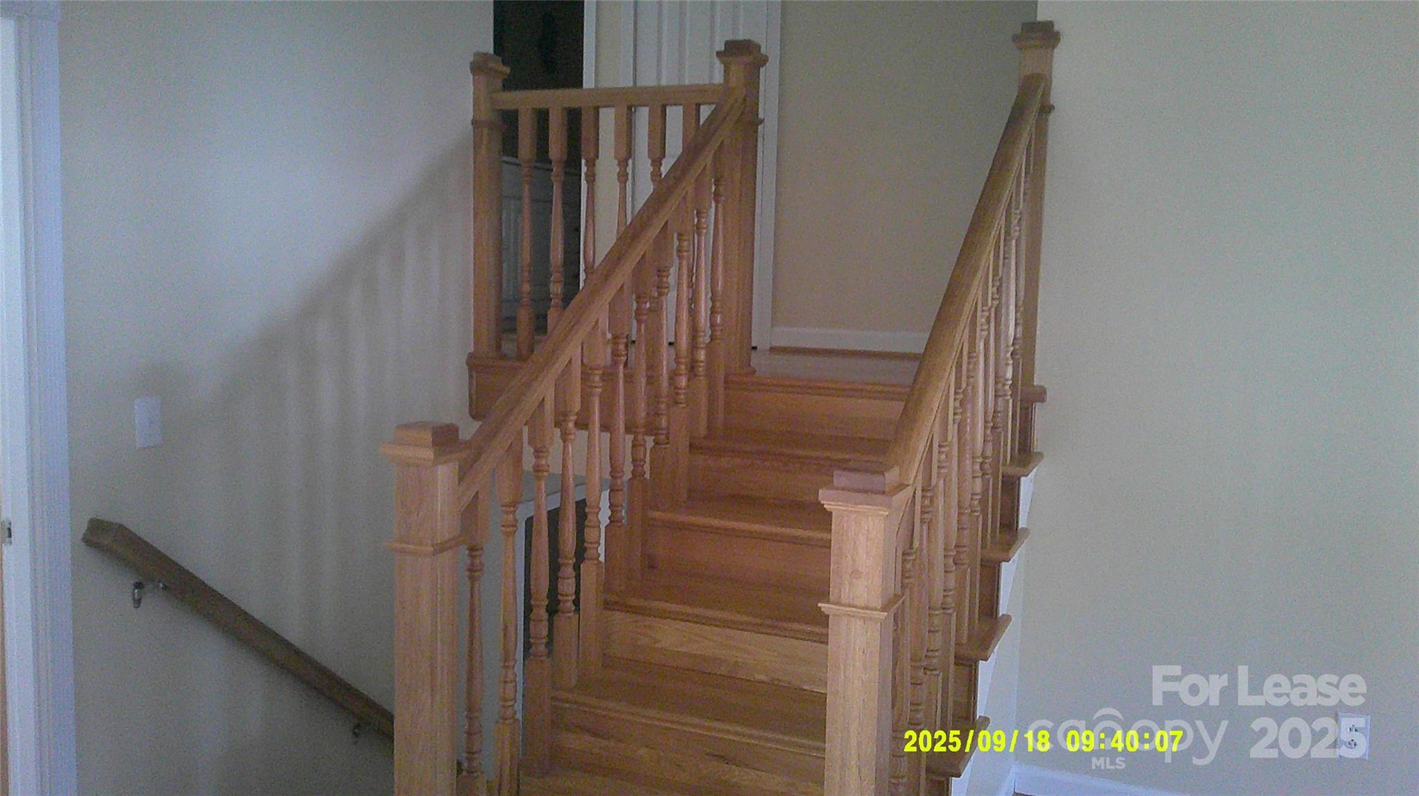 2521 31st St Drive Northeast Hickory, NC 28601 - Photo 8 of 17 a view of staircase with wooden floor and white walls