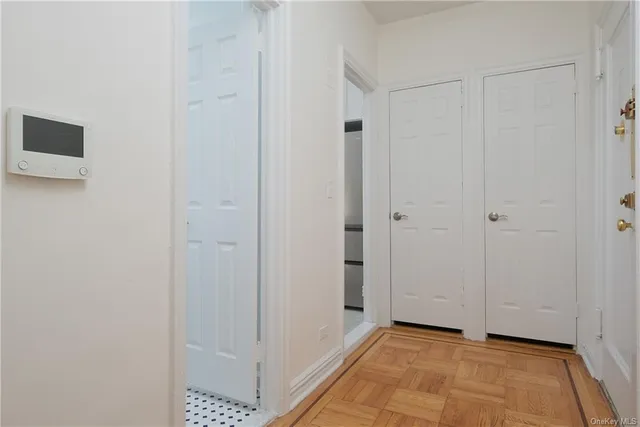 a view of a hallway with closet area