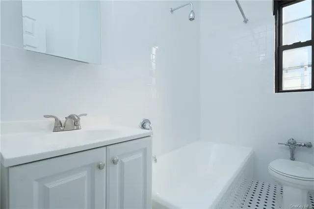 a bathroom with a sink toilet and bathtub