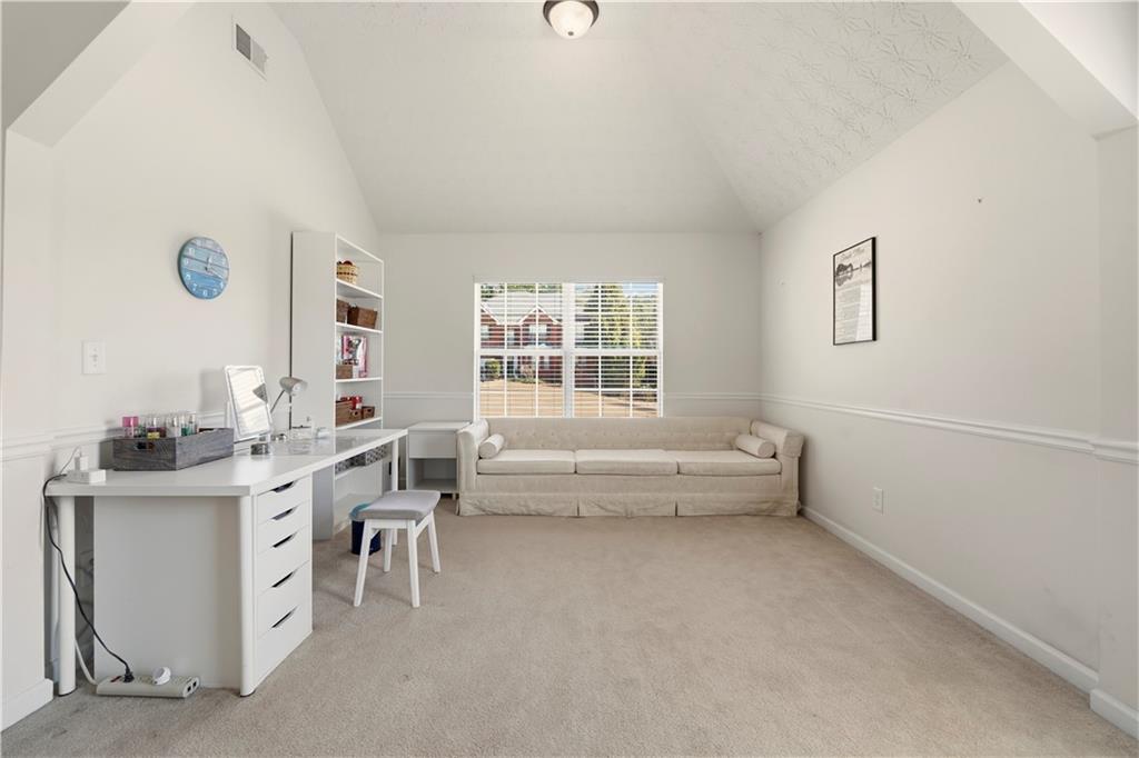 2708 Oakmont Way Monroe, GA 30656 - Photo 23 of 40 a view of workspace with lounge chair and windows