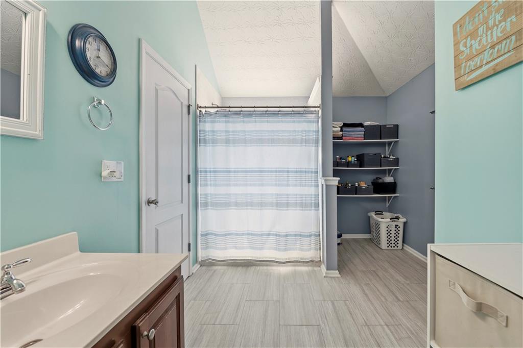 2708 Oakmont Way Monroe, GA 30656 - Photo 25 of 40 a view of a hallway to a dining room with wooden floor
