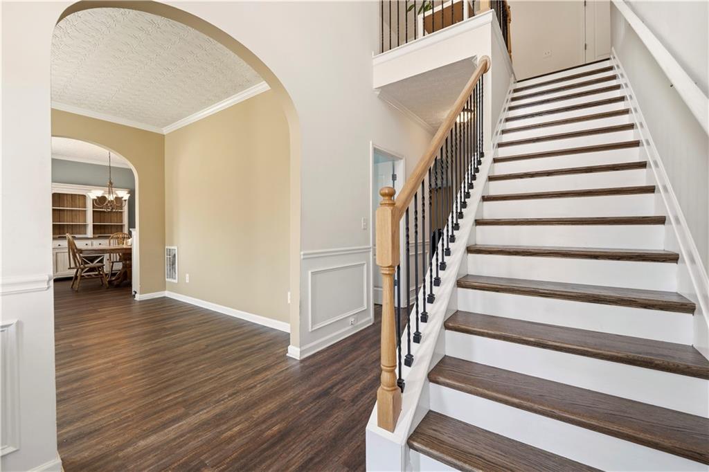 2708 Oakmont Way Monroe, GA 30656 - Photo 3 of 40 a view of a hallway with wooden floor and entryway