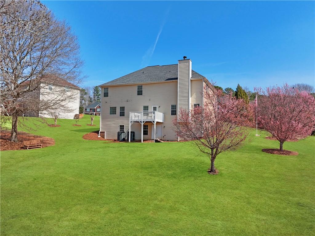 2708 Oakmont Way Monroe, GA 30656 - Photo 33 of 40 a house view with a garden space