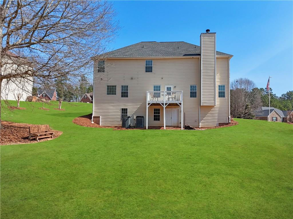 2708 Oakmont Way Monroe, GA 30656 - Photo 34 of 40 front view of a house with a yard