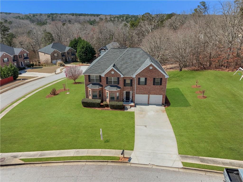 2708 Oakmont Way Monroe, GA 30656 - Photo 35 of 40 a aerial view of a house with a big yard plants and large trees