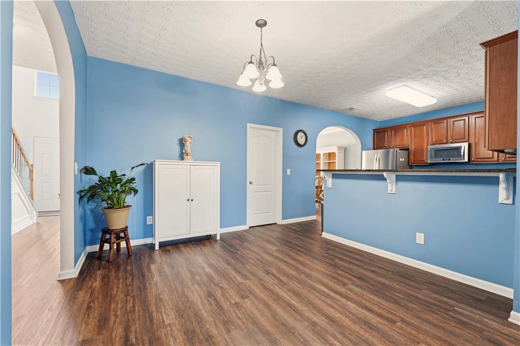 2708 Oakmont Way Monroe, GA 30656 - Photo 10 of 40 a view of a kitchen with wooden floor and potted plant