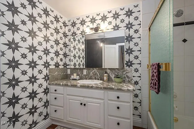 a bathroom with a sink and a mirror