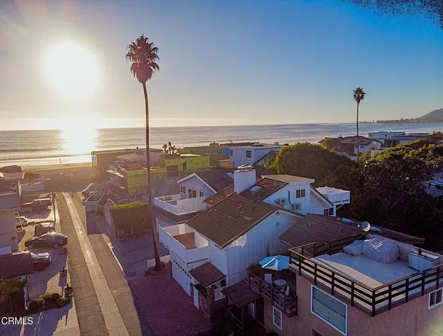 an aerial view of a house with outdoor space
