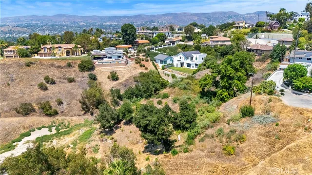 an aerial view of house with yard