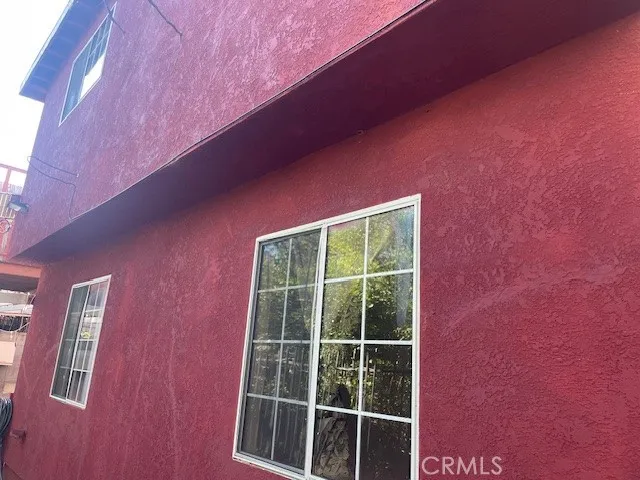 a front view of a house with a street