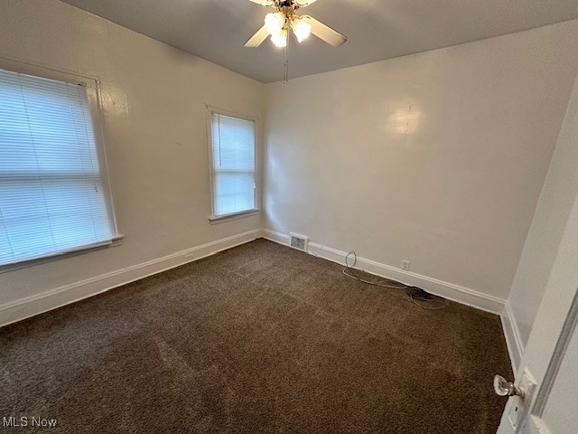1612 Hillcrest Road Cleveland, OH 44118 - Photo 24 of 29 Empty room with dark carpet and ceiling fan