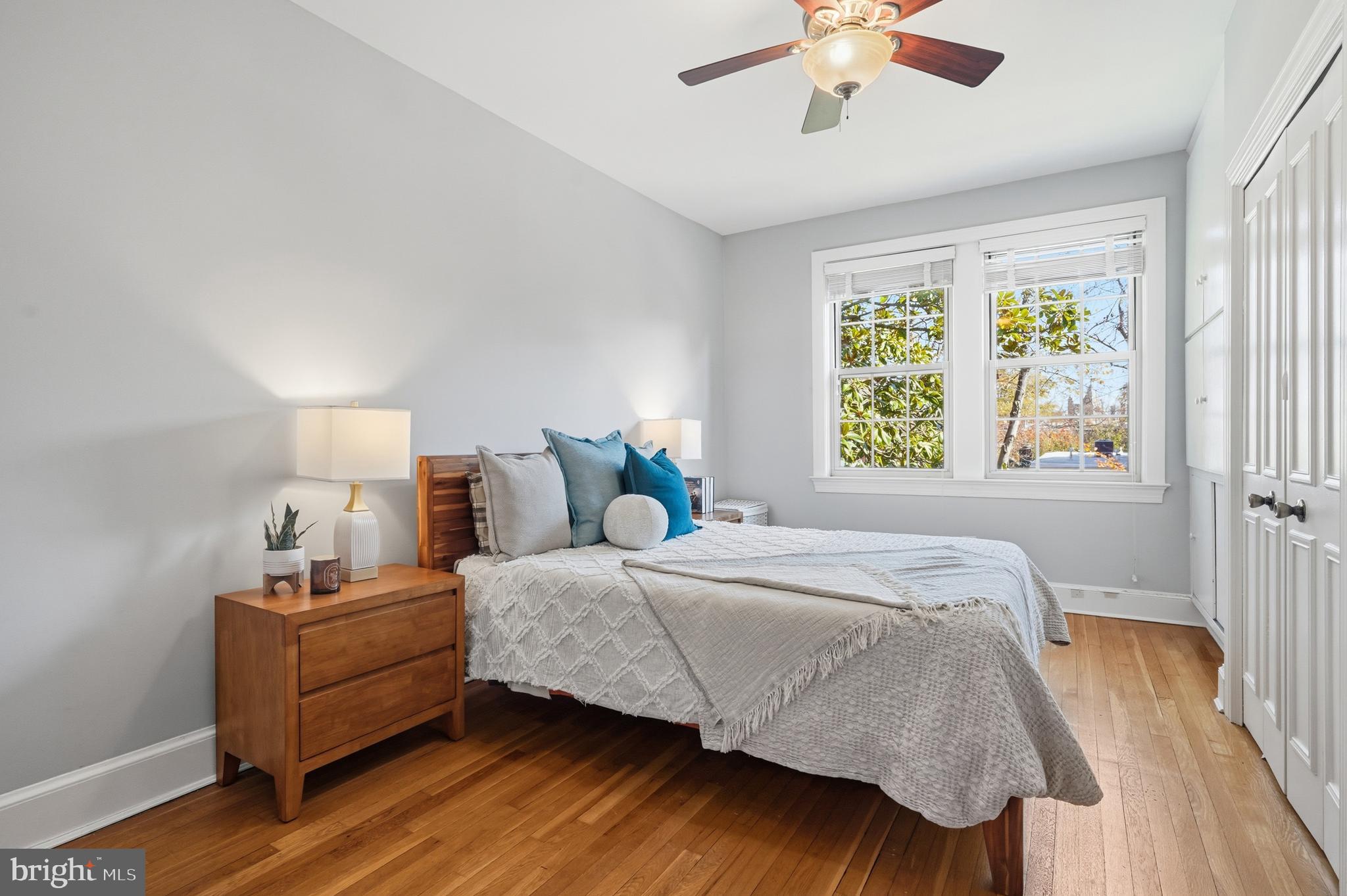18 9th Street Northeast, Unit 302 Washington, DC 20002 - Photo 15 of 38 a bedroom with a bed and a window