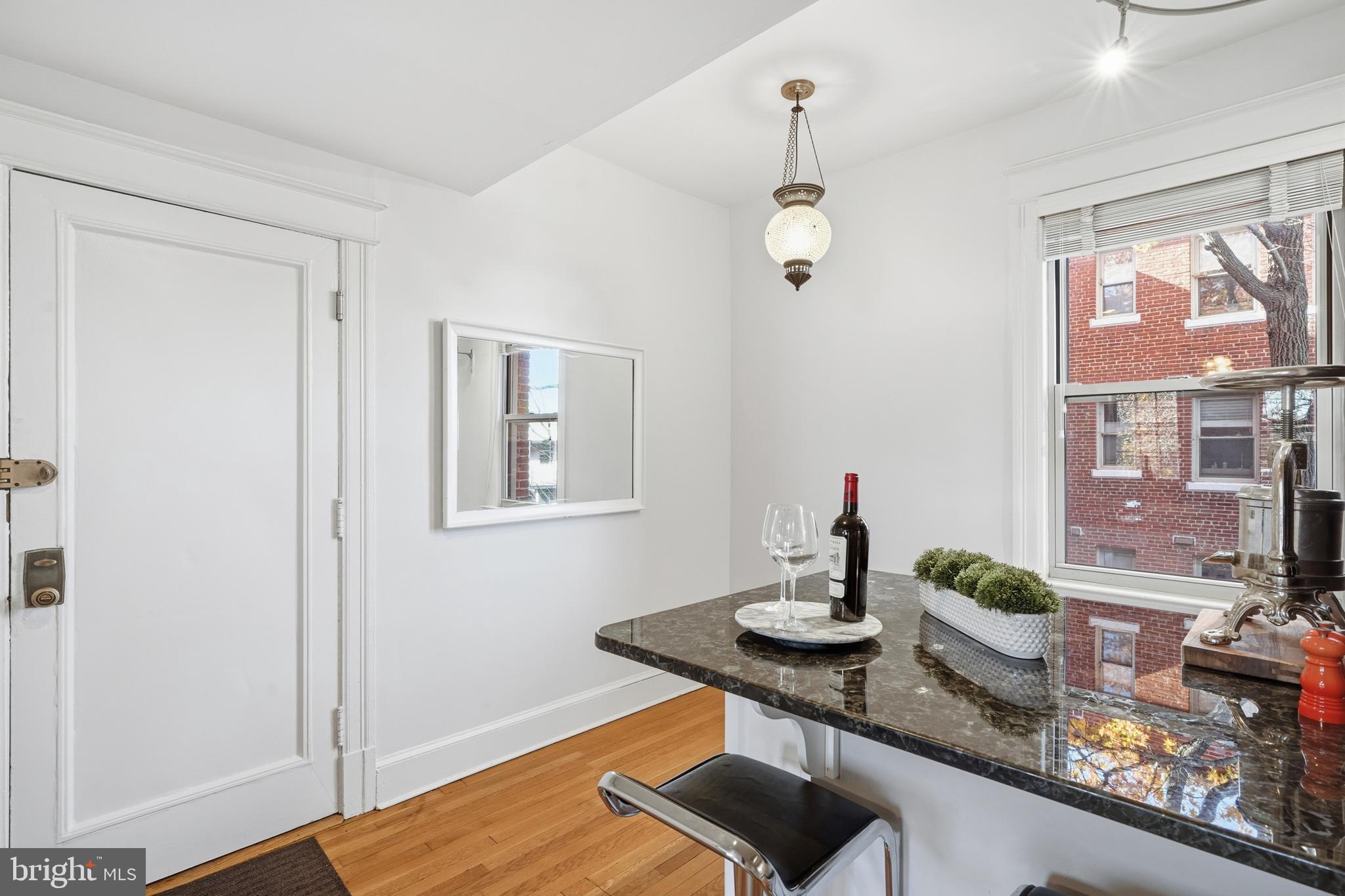 18 9th Street Northeast, Unit 302 Washington, DC 20002 - Photo 10 of 38 a dining room with table and chairs