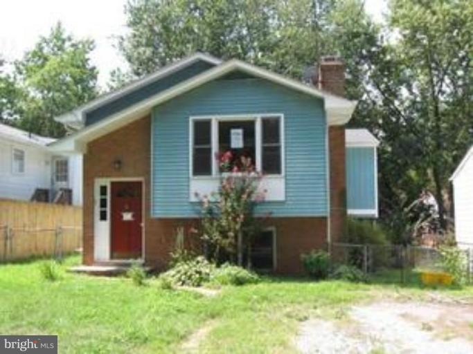 1730 Ridgely Road Edgewater, MD 21037 - Photo 1 of 1 a front view of a house with garden