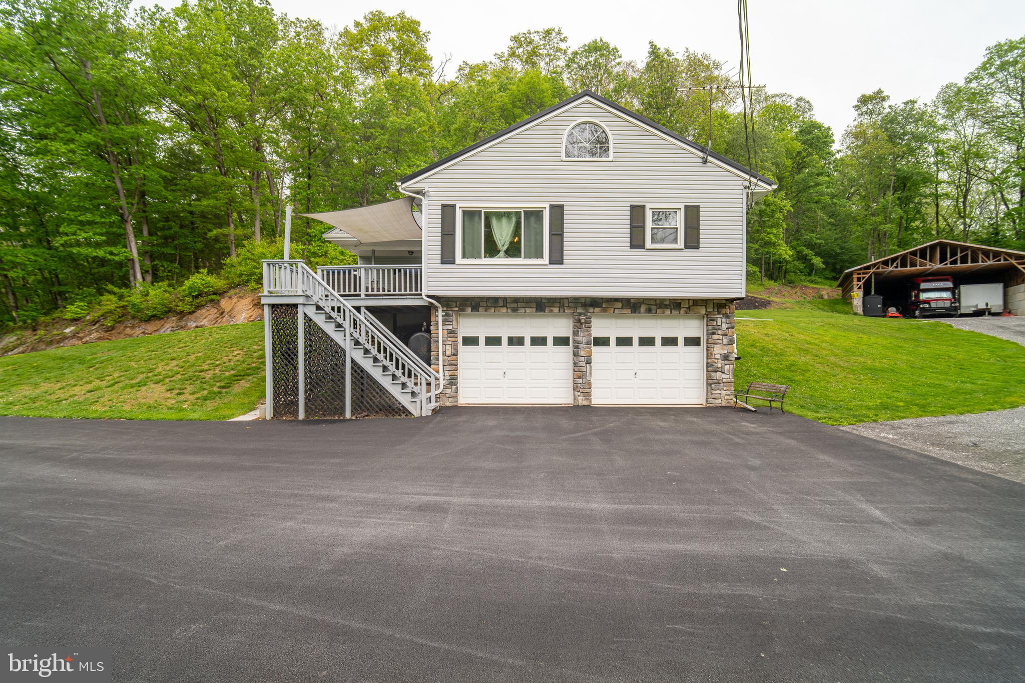 13127 Manor Furnace Road Brogue, PA 17309 - Photo 10 of 78 a view of a house with a yard and garage