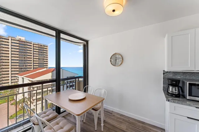 a kitchen with stainless steel appliances kitchen island granite countertop a stove and a sink