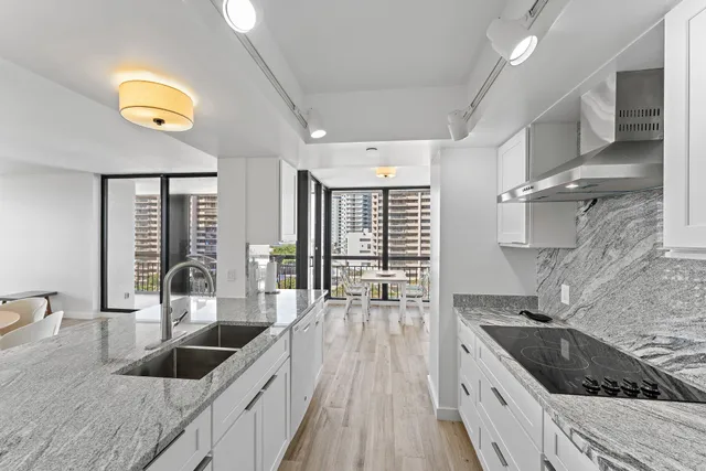 a view of a city from a balcony dining area