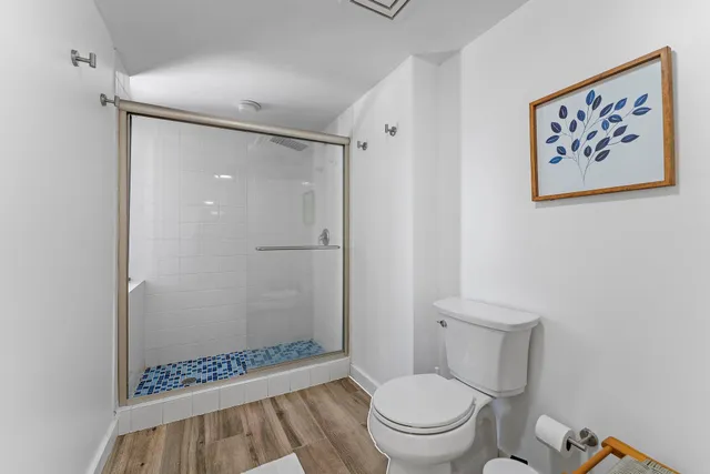 a bedroom with two beds and a large window